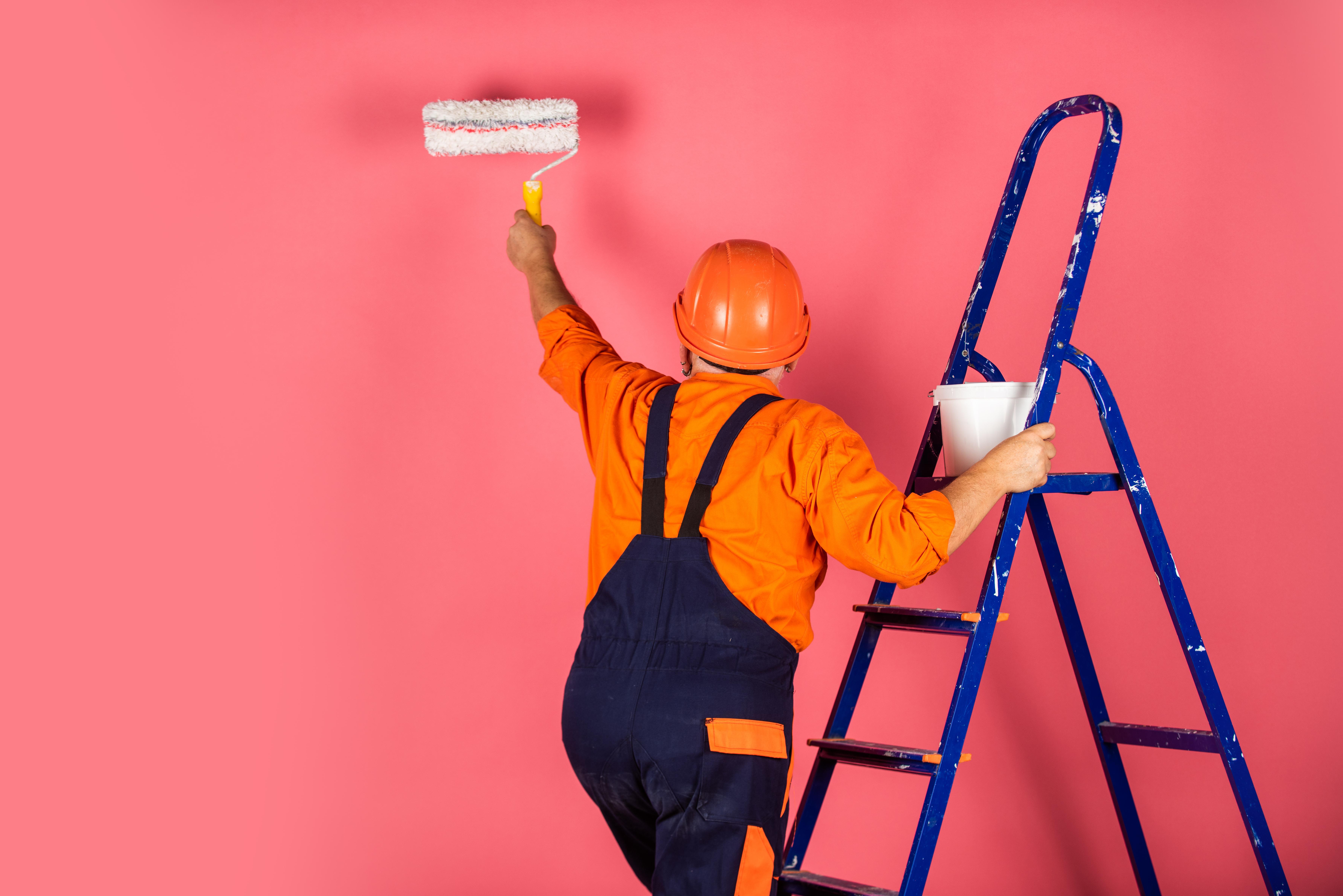 He loves his job. making repair tool. Painter working at construction site. senior man use roller on ladder. work in apartment. Craftsman With Paint Roller. House Painting and Renovation Business